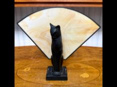 Art Deco Style Table Lamp, in the form of a black cat sitting in front of a fan shaped marble shade.