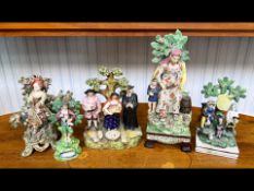 Five Antique Staffordshire Pottery Figures, bocage style with decorative foliage behind, figures