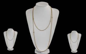 Antique Period Ladies 9ct Gold Ornate Long Chain. Marked 9ct of Excellent Warm Colour. c.1900.