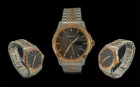 Gucci - Gents Heavy and Stylish Gold Tone and Steel Quartz Wrist Watch. Case Ref 1264. Features a