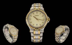 Gucci Wrist Watch in bi metal, cream dial, large face, baton numerals, quartz movement. In working