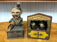 Two old cast iron style money boxes.