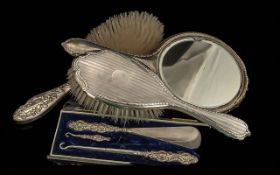 Small Mixed Lot of Silver Oddments, two brushes, hand mirror, shoe horn and hooks.