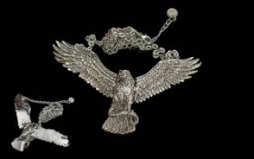 Butler & Wilson Silver Tone Eagle Pendant depicting an eagle holding a snake, suspended on a