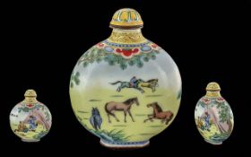 A Chinese Hand Painted Snuff Bottle depicting figures and horses. Qianlong marks to base. Height 4.5
