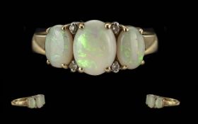 Ladies - Pleasing 9ct Gold 3 Stone Opal and Diamond Set Ring. Full Hallmark to Shank. Well Matched