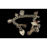 925 Sterling Silver Charm Bracelet Loaded with Charms. All Stamped for Silver. Approx Weight 58