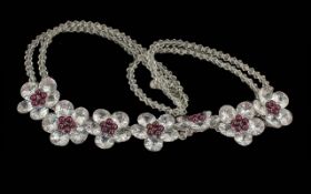 Butler & Wilson Vintage Crystal Necklace, featuring seven crystal adorned flowers with garnet-
