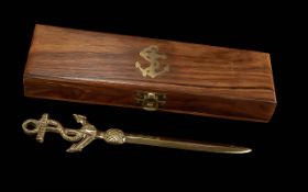 Solid brass naval letter opener in custom wooden box.