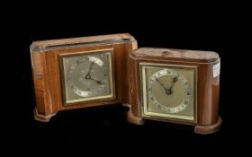 Two Mahogany Elliott Mantle Clocks, both with silvered dials and Roman numerals, one marked for