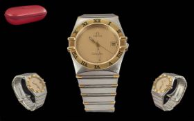 Omega - Constellation Stylish Gents 18ct Gold and Steel Quartz Wrist Watch. Features 18ct Gold Bezel