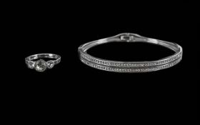 Swarovski Crystal - comprises a Swarovski ring set with three round crystals, ring size Q, and a