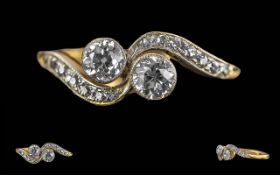 Ladies 18ct Gold and Platinum Two Stone Diamond Set Ring with Diamond Set Shoulders. Marked 18ct and