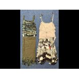 Ladies Designer Outfits, comprising a dark green long skirt with green patterned feathered hem,