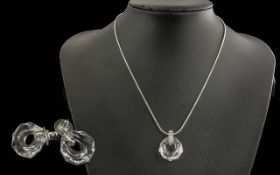 Two Swarovski Necklaces, one a necklace and earring set of faceted crystals in a rhodium plated