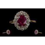 Ladies 18ct Gold Pleasing Ruby and Diamond Set Ring. Flower head Design. The Central Ruby of Good