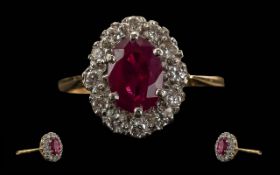 Ladies 18ct Gold Pleasing Ruby and Diamond Set Ring. Flower head Design. The Central Ruby of Good