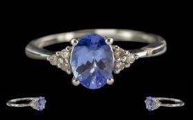 9ct White Gold Tanzanite And Diamond Ring, Central Oval Cut Tanzanite Set Between 6 Round Modern