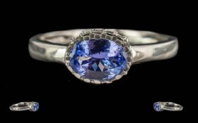 9ct White Gold Tanzanite And Diamond Ring, Central Oval Cut Tanzanite Set Above 10 Round Modern