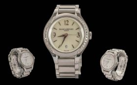 Ladies Baume & Mercier Wristwatch, white dial, silver Arabic and baton markers, date aperture,