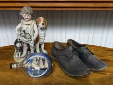 Small Collection comprising Bisque Piano Dog Figure, pair of clogs, and a ship in a bottle.