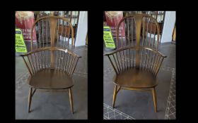 Two Ercol Chairmaker Spindle High Back Chairs, traditional style, cross stretcher, measure 42'' high