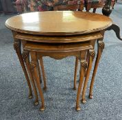 Nest of Three Mahogany Oval Tables, with cabriole legs and shell knuckles. Largest measures 21'' x