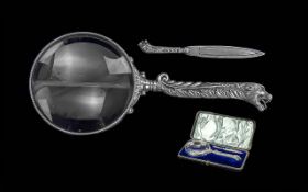 Antique German Silver Heavily Embossed In the Form of a Wild Cats Head Magnifier and Paper Turner
