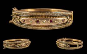 Victorian Period 1837 - 1901 Ladies 9ct Gold Hinged Bangle Set with Rubies / Diamonds. Marked 9ct.