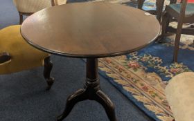 Georgian Oak Tilt Top Table, on tripod legs, turned supports, height 27'', diameter 28''.