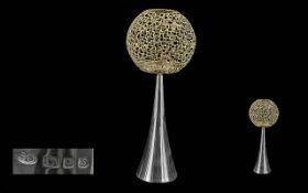 Stuart Devlin Silver Candle Holder, trumpet shaped base supporting an openwork globular shade with