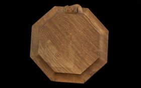 Robert Mouseman Thompson of Kilburn - an oak octagonal tea pot stand, carved with signature mouse,