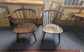 Two Small Ercol Spindle Back Chairs, traditional style, curved spindle back, stretchers. 27'' high.