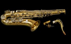 Large Sized Brass Saxophone, with engraved decoration to the Horn, with serial number 406248. 32''