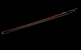 A Good quality antique silver mounted Violin Bow. 74 cm in length.