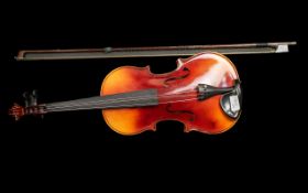 A Good Factory Made Fiddle in a Fitted Case, 4 x 4. Labelled Tatra by Rosseti. Stradivarius model.