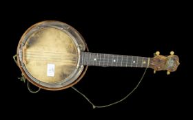 A George Formby Small Sized Signed Ukulele, labelled. Signed in pencil to the drum 'George