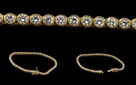 Ladies Superb 18ct Gold Diamond Set Line Bracelet marked 750 - 18ct. Well matched brilliant cut