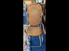 Chrome & Wicker Designer Tubular Rocking Chair, of modernistic Italian form.