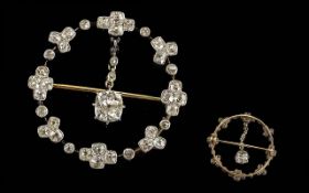 An Edwardian Circular Diamond Openwork Brooch border set with old cushion cut diamonds, with a