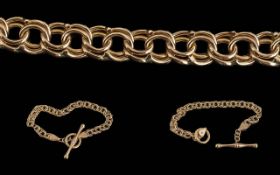 A Fine 9ct Gold Double Link Bracelet with t-bar, fancy design, marked 375 - 9ct. Warm coloured gold.