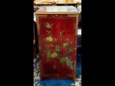 Oriental Red Lacquered Cabinet, with a lift up lid and cupboards fitted below, decorated with