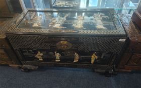 Highly Decorated Chinese LAcquered Trunk, highlighted in gilt worked decorations. The top and