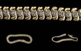 Ladies Pleasing 9ct Gold Diamond Set Line Bracelet, with full hallmark, well matched small diamonds.