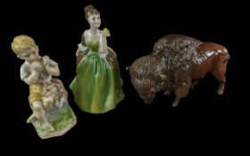 Three Pieces of Pottery, to include a Beswick Bison Model No. 1019, a Royal Doulton figure 'Fleur'