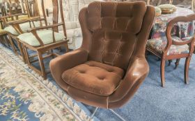 1970's Vono Swivel Egg Chair, upholstered in brown velvet fabric, raised on chrome legs.