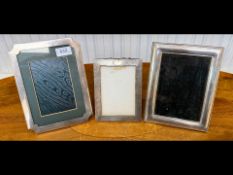 Three Hallmarked Silver Photograph Frames, sizes measure 8 x 5.5'', 7 x 5'' and 5.5 x 4''.