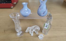 Two Lalique Figures, comprising an Elephant measures approx. 3'' x 5'', and a Frog approx. 2'' high.