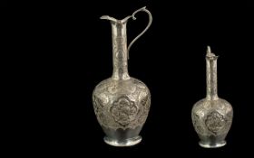 Persian Silver Drinks Set, to include a tray with a Ewer and five small goblets, a match holder,