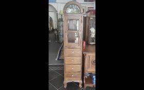 Indonesian Mahogany Tall Display Cabinet, trunk or coffin shape, oval top with glazed front and
